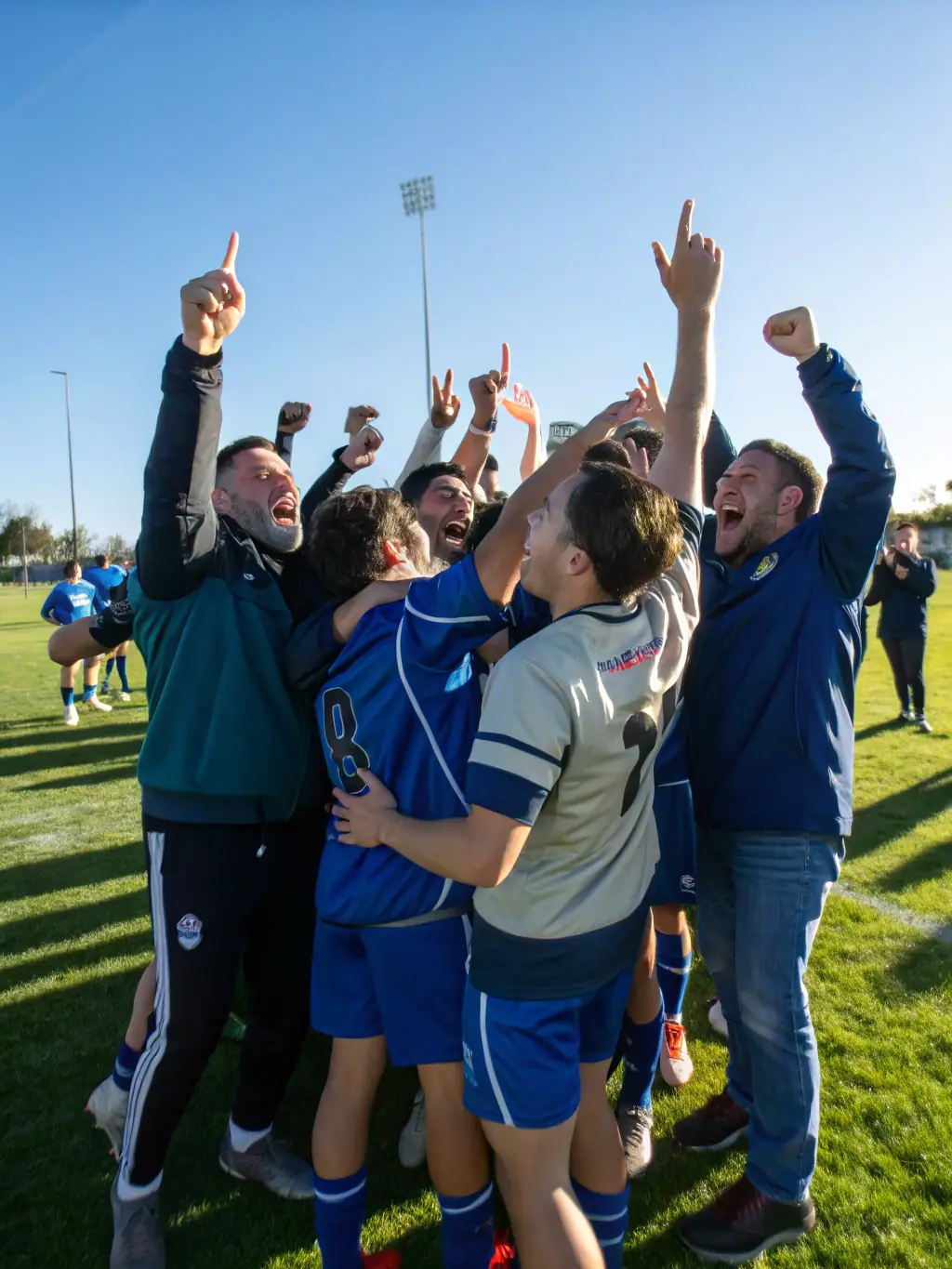 A group of young athletes celebrating a victory, showcasing the joy and camaraderie fostered by UNION SPORTIVE JUILLACOISE.