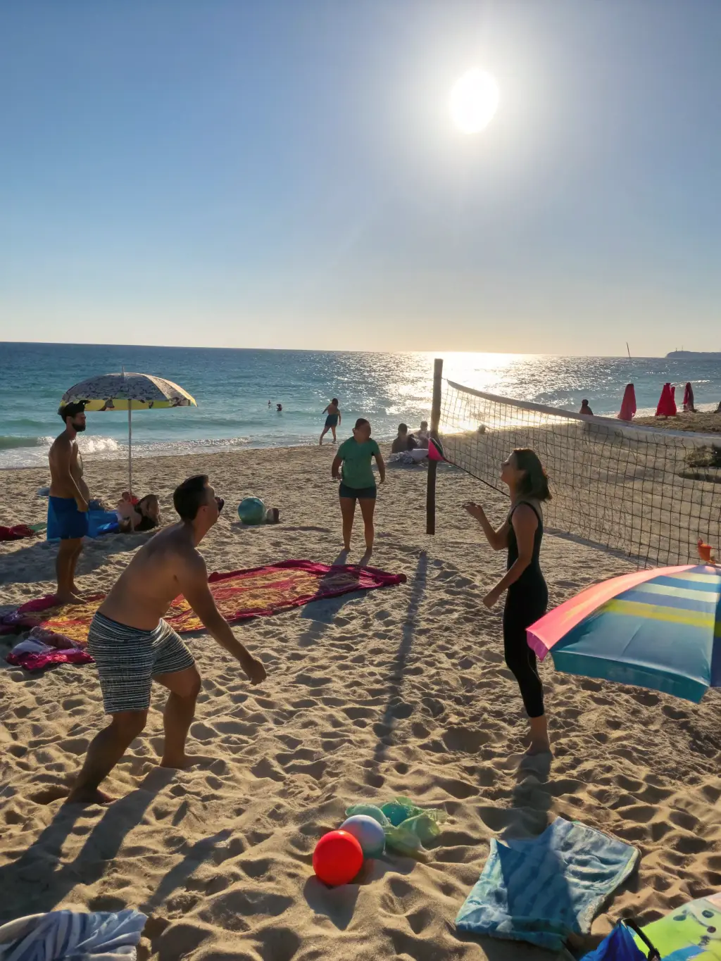 Adults participating in a volleyball match on a beach, emphasizing fitness, social interaction, and friendly competition in a relaxed setting.